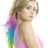Pixelated image of a person with light brown hair wearing a pink sleeveless top, holding a rainbow-colored object against a white background.