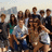 Group of people in casual clothing with varied poses and expressions, set against a light background with blurred shapes.