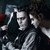 Two pixelated show a character with dark hair and pale skin, one holding an axe-like object; red text reads 'Never Forget' in both