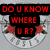 Red pixelated text on black rectangular blocks arranged over a floral background with roses and green leaves.