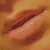 Close-up of lips with subtle color variation across four , showing slight shifts in lip position and shading