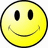 A yellow smiley face icon with black eyes and a curved mouth, surrounded by pixelated text reading "SMILE," "it makes people wonder..." and "What your thinking." on a black background.
