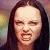 A four- shows a person with long dark hair in sequential facial expressions against a blurred multicolored background