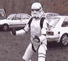 Stormtrooper figure in white armor with black accents walks left to right across four , each showing a different step of the walking cycle
