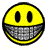 Yellow circular face with black oval eyes and a wide gray mouth showing teeth, displaying text below.