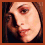 Four pixelated close-up views of a person's face arranged in a , each showing different angles and expressions with brown hair visible