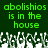 Green pixelated text on dark green background with white and gray abstract shapes below.