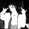 Black-and-white image of a person in a dark jacket with white inner lining making hand gestures near their head, overlaid with red text changing across frames.