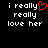 Pixelated text on black background with red heart replacing 'y' in 'really' on left side, identical text on right side.