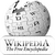 Pixelated grayscale image of a spherical object with crater-like indentations and a small rectangular feature, positioned above a horizontal bar containing stylized text.
