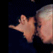 Animated sequence showing two figures in close proximity with shifting poses and lighting
