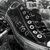 Grayscale pixelated image with abstract dark and light shapes, no discernible subjects or text.