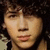 A four- shows a person with curly dark hair and light skin in different poses against beige backgrounds