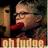 Pixelated image of a person with short light hair and glasses, wearing red clothing against dark background with visible text at bottom.