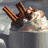 Animated sequence showing a pot with cinnamon sticks and ice cream, a green Christmas tree, and a snowman with a green scarf and top hat.