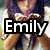 A pixelated image of a person with long dark hair holding a small object, overlaid with large text reading "Emily Rocks" in white letters on black rectangular backgrounds.
