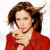 Woman with brown hair in red jacket, hand near chin against white background; green text 'Original Icons .com' on dark green