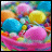 Pixelated abstract composition of overlapping rounded shapes in bright cyan, pink, yellow, and orange hues against a multicolored background.