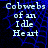 Blue cobweb pattern background with white text reading "Cobwebs of an Idle Heart" in four lines, displayed across multiple