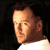 Pixelated static image of a man's face and upper shoulders against black background, likely Bruce Willis from 2000s-era AIM buddy icon collection.