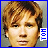 nine identical pixelated headshots with brown hair and neutral expression, each paired with a blue 'TOM' text label on the right side