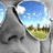 Pixelated static image shows a large gray structure with black accents against blue sky and white clouds, featuring a yellow-green curved section on the right.