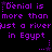 Purple pixelated text on black background repeats 'Denial is more than just a river in Egypt' with star and dot decorations.
