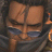 Pixelated anime-style character face with dark scarf and blue eyewear on left, alongside black background with white pixelated text "Anime IM" above smaller "com" on right.