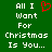 Green background with white pixelated text reading "All I Want For Christmas Is You..." and a red heart symbol replacing the 'O' in 'For'.