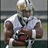 Pixelated image of a person in sports gear holding an object, wearing white and brown clothing with dark accents.