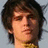 A pixelated image of a person with dark hair and light skin, next to blue text on black background reading "Lets Finish This Together".