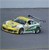 Pixelated yellow and white vehicle with dark blue accents on a gray background, viewed from a side angle.