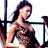 Static pixelated image of a woman with long dark hair in a strapless top, positioned against gym equipment background.