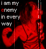 Red-tinted figure in striped top holding microphone, text "i am my enemy in every way" repeated across with red and white vertical lines