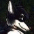 A pixelated animal head with dark fur and white markings on a black background, next to green text reading 'Original Icons .com' in stylized font.