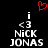 Pixelated black background with white text 'i <3 NICK JONAS' repeated twice, red heart symbol above text, static image.