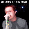 identical static images showing a person singing into a microphone with text above and below, set against a dark background with blue dots