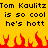 Yellow background with black pixelated text repeating 'Tom Kaulitz is so cool he's hott' and red flame graphics at the bottom.