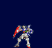 Pixelated mecha with red shoulder armor and white chest shield stands in multiple poses against dark blue background.