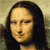 Pixelated image of a person with long dark hair and a neutral expression, shown in two side-by-side frames with slight facial differences.