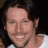 A person with long dark hair and a white shirt appears in two ; the right 's background changes from green to gray while text remains