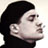 Pixelated static icon of a person's profile with dark hair and light skin, cropped to show head and shoulders against a plain background.