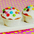 Pixelated icon shows a character with a white top and brown pants holding a colorful circular object against a pink and yellow gradient background.