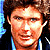Pixelated image of a person with brown hair wearing dark clothing, next to bold text reading 'I love the 80's' on alternating pink and light blue background.
