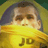 Pixelated static image of a person wearing a yellow shirt with partial text, set against a blurred background.