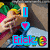 A pixelated image shows a person holding a colorful object with a blue 'I' icon, pink heart, and 'Erick' text in blue and pink letters.