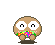 Pixelated brown character with large white eyes and pink cheeks, holding colorful pixel clusters in hands while standing on a dark base.
