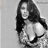 Static grayscale buddy icon of a woman with long dark hair in a close-up pose, rendered at low resolution with pixelated details and visible dithering.