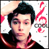 A person with dark hair wearing a dark top with red trim, hand raised to head, next to a red musical note and partial text 'COOL' on a white background with black dots.