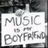 Static grayscale icon with pixelated text reading "MUSIC = BoyFrm" on a white background, framed by dark gray borders.